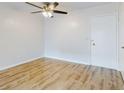 Bright living room with light walls, wood-look floors, and ceiling fan at 3800 Saxon Dr # 39039C, New Smyrna Beach, FL 32169