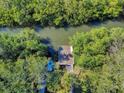 Private dock with a boat on a serene waterway at 4514 Saxon Dr, New Smyrna Beach, FL 32169