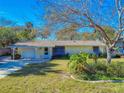 Charming ranch home with a spacious yard and mature trees at 4514 Saxon Dr, New Smyrna Beach, FL 32169