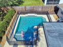 Inviting, fenced-in swimming pool perfect for relaxation at 4514 Saxon Dr, New Smyrna Beach, FL 32169