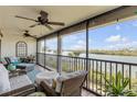 Relaxing balcony with wicker furniture and waterfront views at 460 Bouchelle Dr # 304, New Smyrna Beach, FL 32169