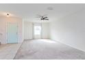 Bright living room with carpeted floors and neutral walls at 4825 Apple Blossom Ln, Saint Cloud, FL 34771