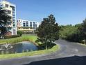 Landscaped grounds with pond and walkways at 5300 S Atlantic Ave # 16201, New Smyrna Beach, FL 32169