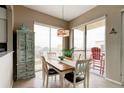 Casual dining area with ocean view and wooden table at 6612 S Atlantic Ave # 2010, New Smyrna Beach, FL 32169