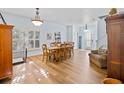 Dining room with hardwood floor and view to the living room at 6932 Vintage Ln, Port Orange, FL 32128