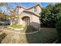 Two-story house with landscaped yard and a two-car garage at 6932 Vintage Ln, Port Orange, FL 32128