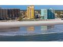 Aerial view of beachfront property, showing ocean and building at 701 N Atlantic Ave # 102, New Smyrna Beach, FL 32169