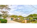 House exterior featuring a driveway and landscaping at 810 E 9Th Ave, New Smyrna Beach, FL 32169