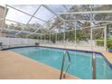 Inviting screened-in pool surrounded by a sun-drenched patio, perfect for relaxing and entertaining at 826 E 12Th Ave, New Smyrna Beach, FL 32169