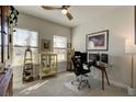 Home office with a glass top desk and built in shelving at 1002 Chelan Falls Dr, Deland, FL 32724