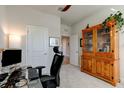 Home office with wood cabinet and a glass top desk at 1002 Chelan Falls Dr, Deland, FL 32724