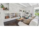 White stone fireplace in living room with dark hardwood floors at 12 Foster Dr, Daytona Beach, FL 32118