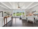 Bright living room with dark hardwood floors, white walls, and white sofas at 12 Foster Dr, Daytona Beach, FL 32118