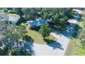 Single-story home nestled amongst mature trees at 1202 12Th St, Edgewater, FL 32132