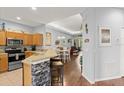 Open kitchen with stainless steel appliances and breakfast bar at 121 Sedona Cir, Daytona Beach, FL 32124