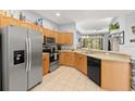 Kitchen features stainless steel appliances and wood cabinets at 121 Sedona Cir, Daytona Beach, FL 32124