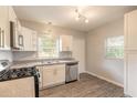 Modern kitchen with white cabinets and stainless steel appliances at 1210 Washington St, New Smyrna Beach, FL 32168