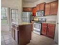 Kitchen with granite countertops and stainless steel appliances at 126 Vista Verdi Cir # 204, Lake Mary, FL 32746