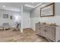 Bright entryway with wood-look tile floor, a console table, and seating area at 142 Jean Francis Ln, Port Orange, FL 32127