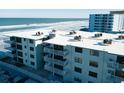 Oceanfront condo building, featuring balconies and ocean views at 1571 S Atlantic Ave # 4110, New Smyrna Beach, FL 32169