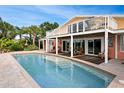 Inviting pool area with extended patio and access to the house at 236 Quay Assisi, New Smyrna Beach, FL 32169