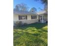 House exterior showcasing a stone facade and landscaping at 2408 Victory Palm Dr, Edgewater, FL 32141