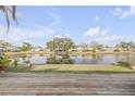 Scenic view of a lake with lush greenery and homes at 28 Lake Fairgreen Cir, New Smyrna Beach, FL 32168