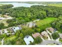 Aerial view showcasing a lakefront property and neighborhood at 3084 Heartleaf Pl, Winter Park, FL 32792