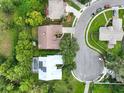 Aerial view of house and neighborhood, showing cul-de-sac at 3084 Heartleaf Pl, Winter Park, FL 32792