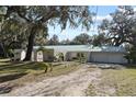 House with a two-car garage and a long driveway at 384 W Ariel Rd, Edgewater, FL 32141