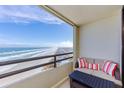 Balcony with ocean view and seating area at 3855 S Atlantic Ave # 1105, Daytona Beach Shores, FL 32118