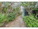 Condo unit's entrance with lush landscaping and walkway at 4150 S Atlantic Ave # 112C, New Smyrna Beach, FL 32169