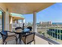 Spacious balcony with outdoor furniture and ocean view at 4650 Links Village Dr # D703, Ponce Inlet, FL 32127