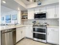 Modern kitchen with stainless steel appliances at 5207 S Atlantic Ave # 1021, New Smyrna Beach, FL 32169