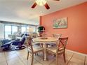 Cozy dining area with table and chairs; adjacent to living room at 5207 S Atlantic Ave # 423, New Smyrna Beach, FL 32169