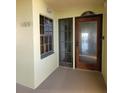 Building entry with wood door and window at 654 Marina Point Dr # 654, Daytona Beach, FL 32114