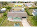 Single story home with a large backyard and shed, seen from above at 705 Wayne Ave, New Smyrna Beach, FL 32168