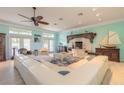 Bright living room with white sectional sofa and light teal walls at 708 Ocean Ave, New Smyrna Beach, FL 32169