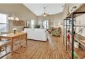 Bright living room with hardwood floors, white couch, and built in shelving at 813 Pine Shores Cir, New Smyrna Beach, FL 32168