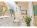 Clean bathroom with white vanity, toilet and shower/tub combo at 933 Meadow View Dr # D, Port Orange, FL 32127