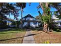 House exterior showcasing a large yard and walkway at 1116 Magnolia St, New Smyrna Beach, FL 32168