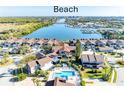 Gorgeous waterfront condo featuring a pool, tropical landscaping, and direct beach access at 113 Lagoon Ct, New Smyrna Beach, FL 32169