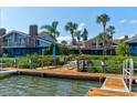 Private dock with picnic tables, offering waterfront access and stunning views at 113 Lagoon Ct, New Smyrna Beach, FL 32169