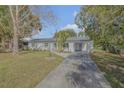 Newly renovated home with a paved driveway at 1339 N Fowler Dr, Deltona, FL 32725