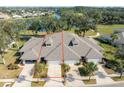 Aerial view showcasing three-unit townhome building at 1938 Turnbull Lakes Dr, New Smyrna Beach, FL 32168