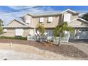 Two-story house with light tan walls, white shutters, and a white picket fence at 201 S Cooper St, New Smyrna Beach, FL 32169