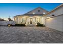 Inviting front entrance of a charming two-story home with a covered porch at 2302 S Atlantic Ave, New Smyrna Beach, FL 32169