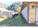 Side yard view with storage shed and basketball hoop at 2309 Lime Tree Dr, Edgewater, FL 32141