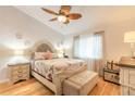 Spacious bedroom with a queen-size bed, light wood floors, and ample storage at 2717 Needle Palm Dr, Edgewater, FL 32141