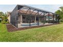 Screened pool with spa and covered lanai at 2824 S Asciano Ct, New Smyrna Beach, FL 32168